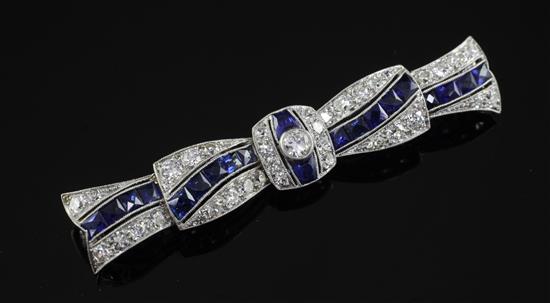 A 1930s/1940s Art Deco white gold, sapphire and diamond brooch, 2.5in.